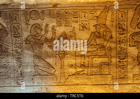 Bas relief of the Ramesses II and Horus in the Great Temple of Abu Simbel Stock Photo
