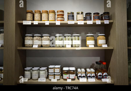 Manila, Philippines - August, 4, 2016: Wooden shelves in a shop full og jars and bottles with natural organic products on display Stock Photo
