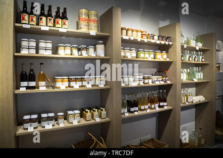 Manila, Philippines - August, 4, 2016: Wooden shelves in a shop full og jars and bottles with natural organic products Stock Photo