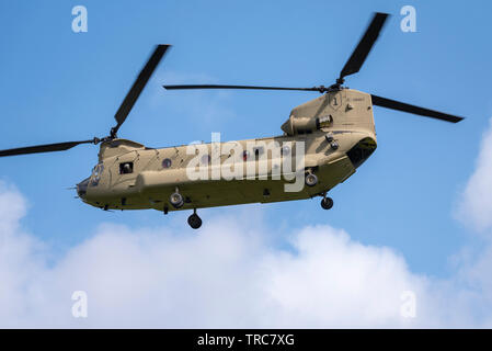 US President Donald Trump arriving for State Visit at Winfield House, the official residence of the US Ambassador to the UK Woody Johnson, escorted by military units for security and support. The green VH-3D Sea King VIP helicopter carrying Trump has the callsign 'Marine One' but flies with a similar helicopter as decoy. Escorted by 2 US Army Chinook  and police helicopters for security. The group arrived over Winfield House, Regent's Park from Stansted Airport, Essex Stock Photo