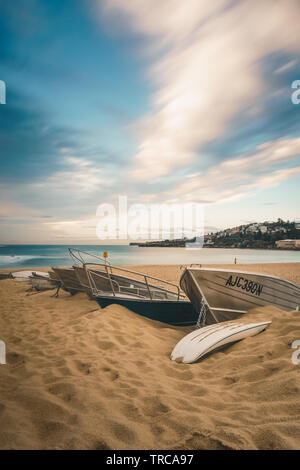 Boats lined up on Coogee Beach, New South Wales Stock Photo