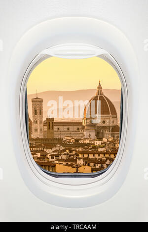 Florence at sunset seen through the window of airplane, travel in Europe concept Stock Photo