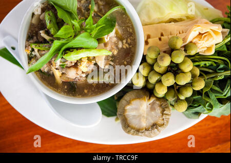 Or Paadaek, rich, robust soup of egg, smoked meat and herbs with paadaek, a fermented fish paste, at Tamarind restaurant, Luang Prabang, Laos. Stock Photo