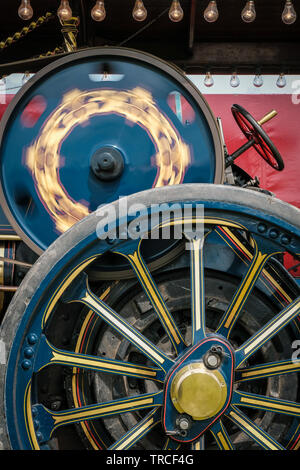 Close-up of the side and large wheel of a vintage traction engine Stock Photo