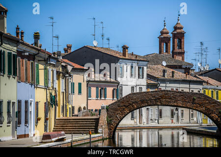 Comacchio, Emilia Romagna, Italy. The colorful houses of the  fisherman village,  situated in a lagoon, surrounded by wetlands and built on more than Stock Photo