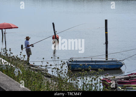Fishing on river, Delta del Po Area, Comacchio, Emilia-Romagna, Italy. June 2019 Stock Photo