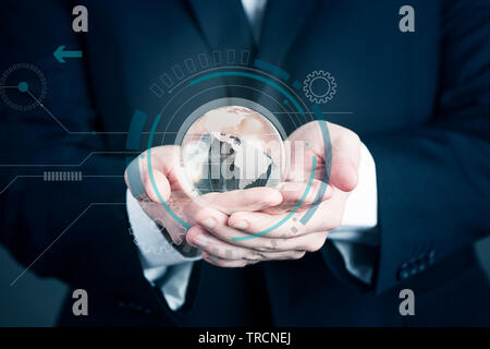 Businessman holding a glass planet. Global business background concept close up Stock Photo