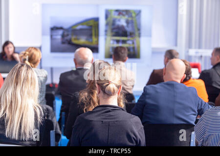 Participants at the professional or business conference listening to a presentation Stock Photo