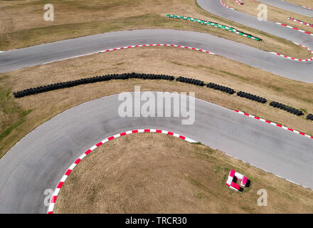 Curves on karting race track, aerial view background. Stock Photo