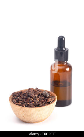 A bottle of myrrh essential oil with myrrh resin on a dark background Stock  Photo - Alamy