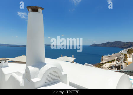 Chimney stack on a white adobe home in Santorini, Greece. Stock Photo