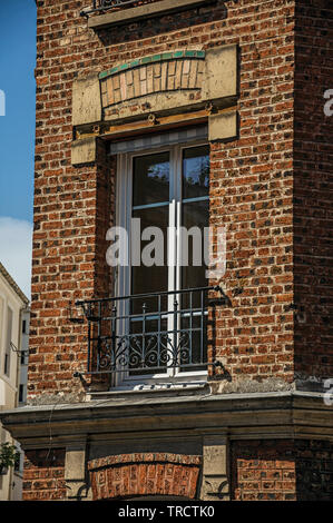 Close-up of window in a brick building and blue sky, early in the morning at Paris. One of the most impressive world’s cultural center in France. Stock Photo