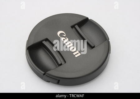 Canon camera lens cap black isolated on white background Stock Photo