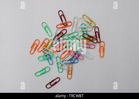colorful paper clips on white background Stock Photo