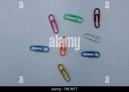 Colorful paperclips on white background Stock Photo
