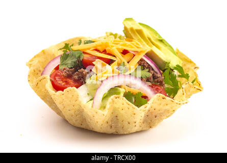 Taco Salad in a Crunch Corn Tortilla Bowl Isolated on a White Background Stock Photo
