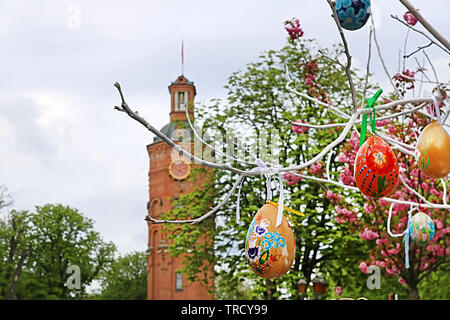 Top view of old fire tower with clock (1911), sakura tree and Easter eggs, Vinnytsia, Ukraine Stock Photo