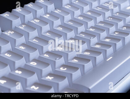 white LED glowing mechanical keyboard - close up Stock Photo
