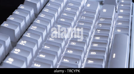 white LED glowing mechanical keyboard - close up Stock Photo