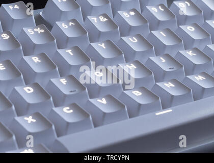 white LED glowing mechanical keyboard - close up Stock Photo