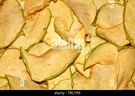 Homemade apple chips natural healthy snack close-up background Stock Photo