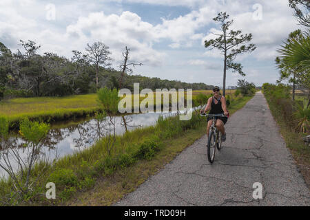 Bicycle riding on Jekyll Island Bike trails Brunswick, Georgia USA Stock Photo