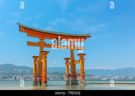 Miyajima island near Hiroshima, Japan - Silhouette of the  Itsukushima Floating Torii Gate on a sunny day Stock Photo