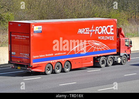 Side view of UK Royal Mail hgv lorry truck & red Parcel Force juggernaut trailer advertising worldwide express parcels delivery on motorway England GB Stock Photo