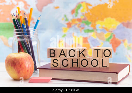 Back to School Background with School Supplies and a World Map in the Background Stock Photo