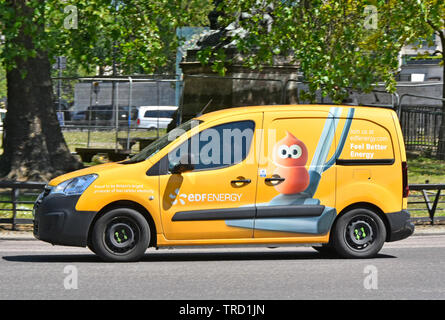EDF yellow van a French business side view of advertising to encourage customers to switch energy supplies via graphic art of vacuum cleaner London UK Stock Photo