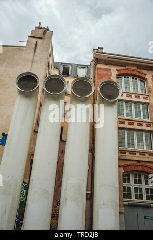 Exhaust pipelines in front of building on cloudy and rainy day in Paris. One of the most impressive world’s cultural center in France. Stock Photo