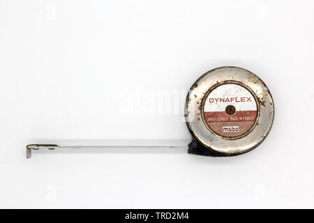 Old french roll measuring tape, isolated on white background, close-up Stock Photo