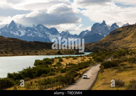 Single car driving on dirt road in Patagonia, Chile Stock Photo