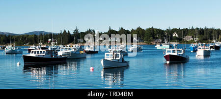 Lobster boats are moored in Bass Harbor on a summer Sunday as this is there day off. Stock Photo