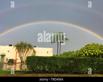 Rainbow taking after the storm, perfect rainbow big and all colors definitions Stock Photo