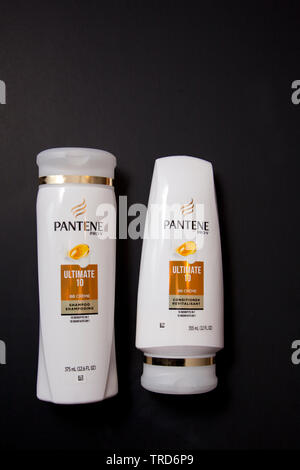 Halifax, Canada- June 1, 2019: Two bottles of Pantene Ultimate 10 Shampoo and Conditioner for hair care against a black background Stock Photo