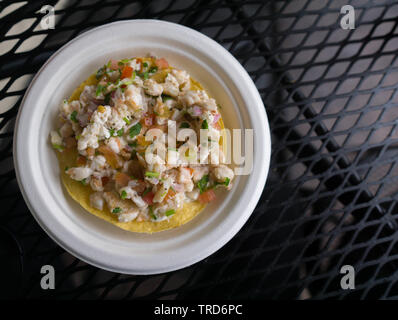 baja mexico refreshing shrimp ceviche tostada on a white plate Stock Photo