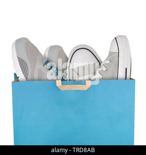 Shopping bag with sport shoes isolated on white background Stock Photo