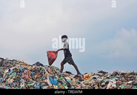 DIMAPUR, India. 04th June, 2019. Indian rag picker search for re ...