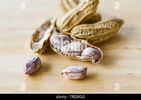 Peanut in shells and wooden background close up / Boiled peanuts Stock Photo