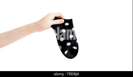Sock with Black and White Dots with Clipping Path. Beautiful Woman Holding Fabric Short Sock and Space for Design on White Background. Warm Polka Dot.