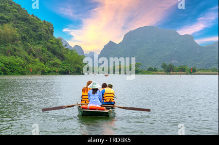 Tourists leaving marina travel to visit Ecotourism the natural landscape in small boat along the river