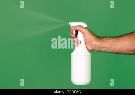 hand holding spray bottle Stock Photo