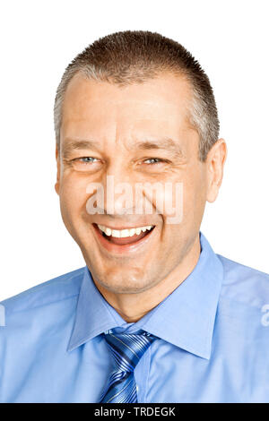 Head / shoulder portrait of a laughing Businessman dressed in a blue shirt and tie Stock Photo