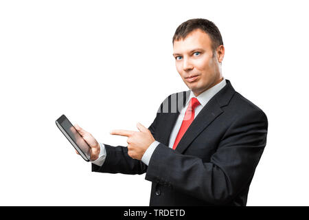 Portrait of a likeable Businessman in a black suit pointing towards a tablet in his hands Stock Photo