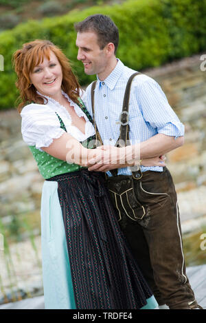 Portrait of a young couple dressed in traditional costumes, Germany, Bavaria Stock Photo