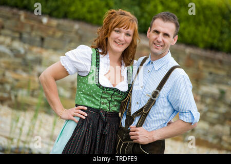 Portrait of a young couple dressed in traditional costumes, Germany, Bavaria Stock Photo