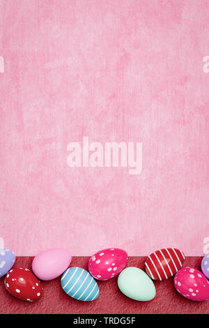 Ester card - empty seasonal greeting card with horizontally arranged row of pink Easter eggs Stock Photo