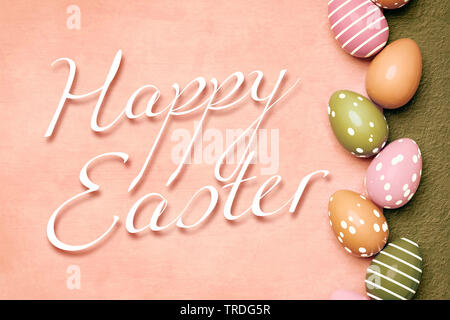 Ester card - seasonal greeting card with vertically arranged row of violet Easter eggs lettering HAPPY EASTER Stock Photo