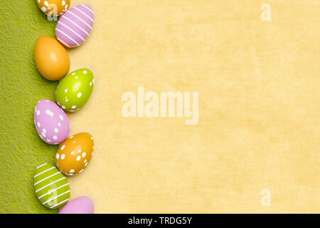 Ester card - empty seasonal greeting card with vertically arranged row of yellow Easter eggs Stock Photo
